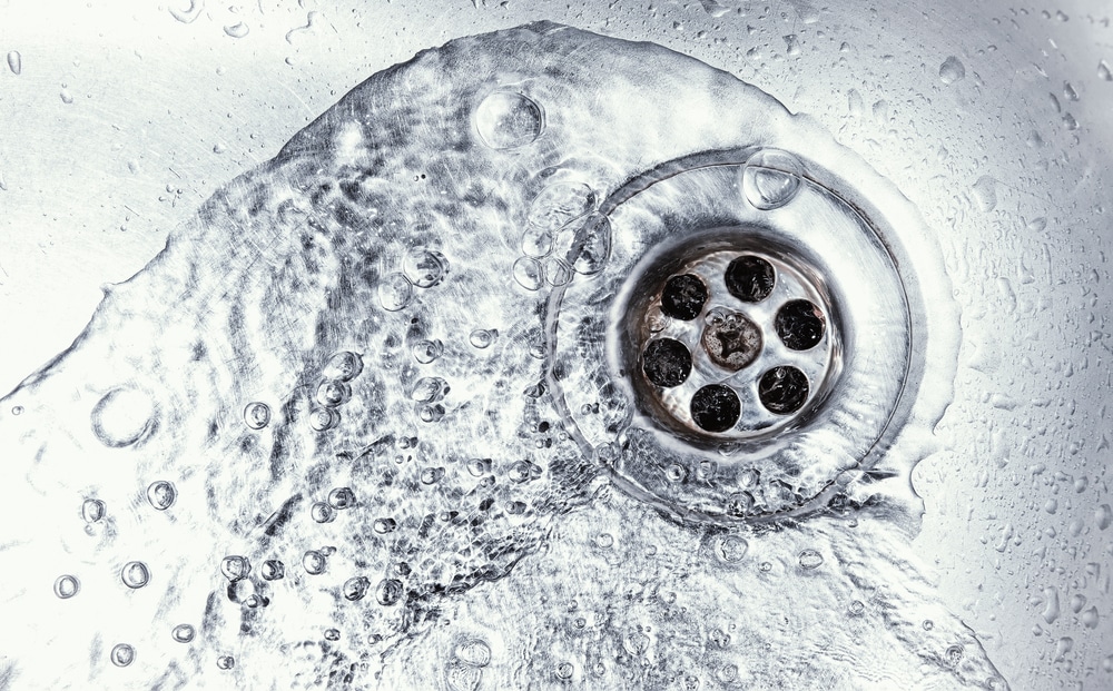drain cleaning, plumbing maintenance, clean drains, professional plumbers, DIY methods, expert tips, Courtesy Plumbers