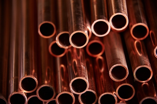 Many,Copper,Pipes,,Warehouse,Copper,Plates.,Close,Up